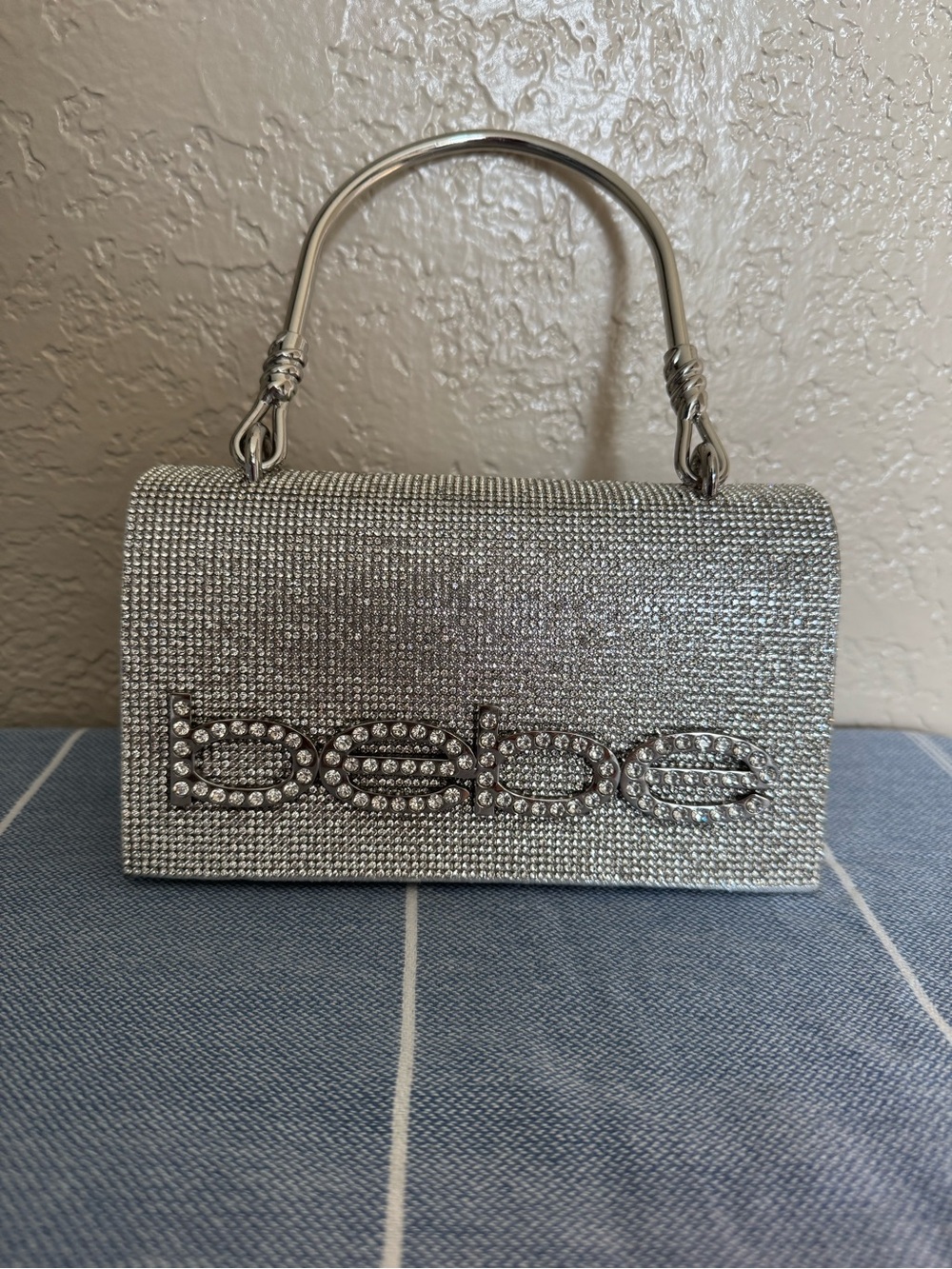 bebe Silver Crystal Logo Top-Handle Evening Clutch